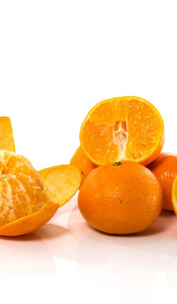 orange raw sliced and in half as healthe nutricion food